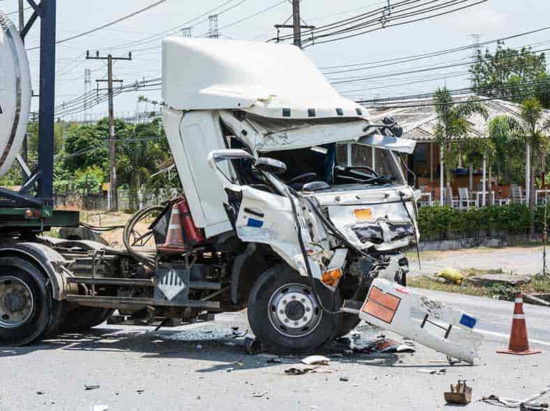 large commercial truck with car accident collision damage