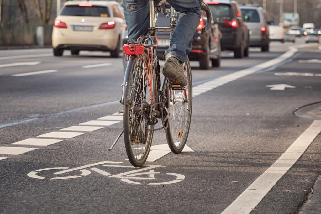 Bicycle rider riding his bike in the bike lane