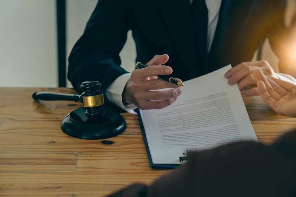 birth injury lawyer meeting with victim at a desk