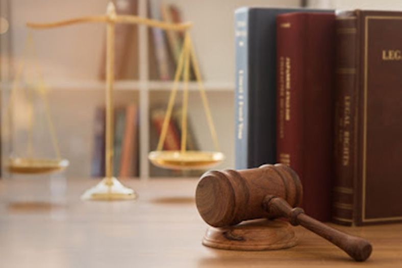 justice gavel and legal books on a desk