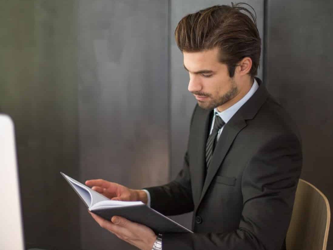 wrongful death lawyer at desk going over paper work