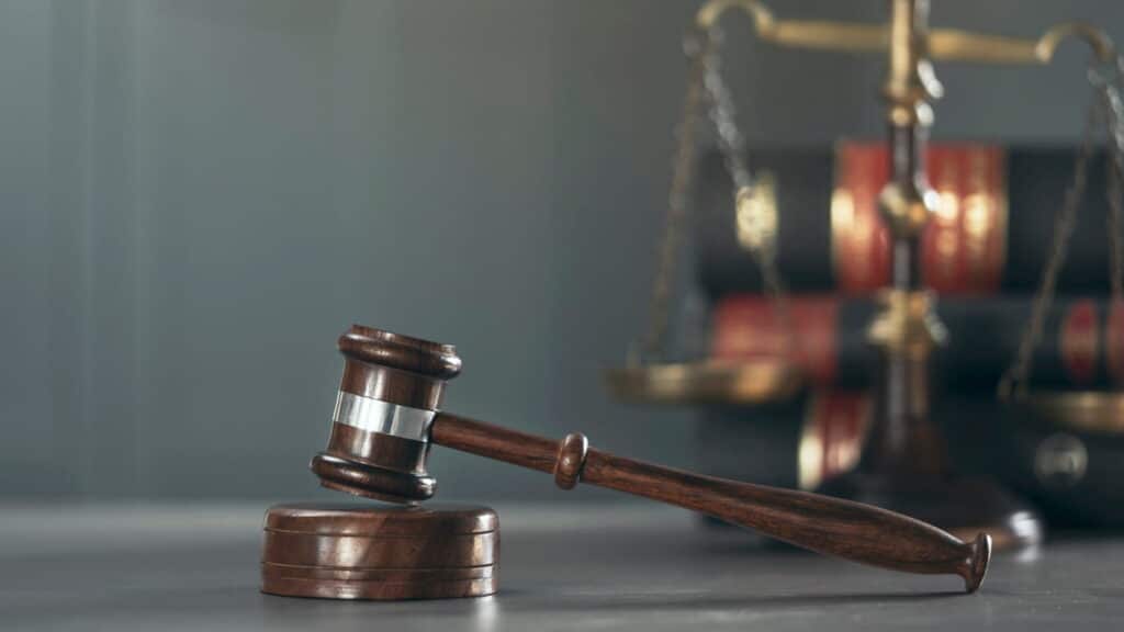 A gavel and the scales of justice on a personal injury attorney's desk in Colorado.